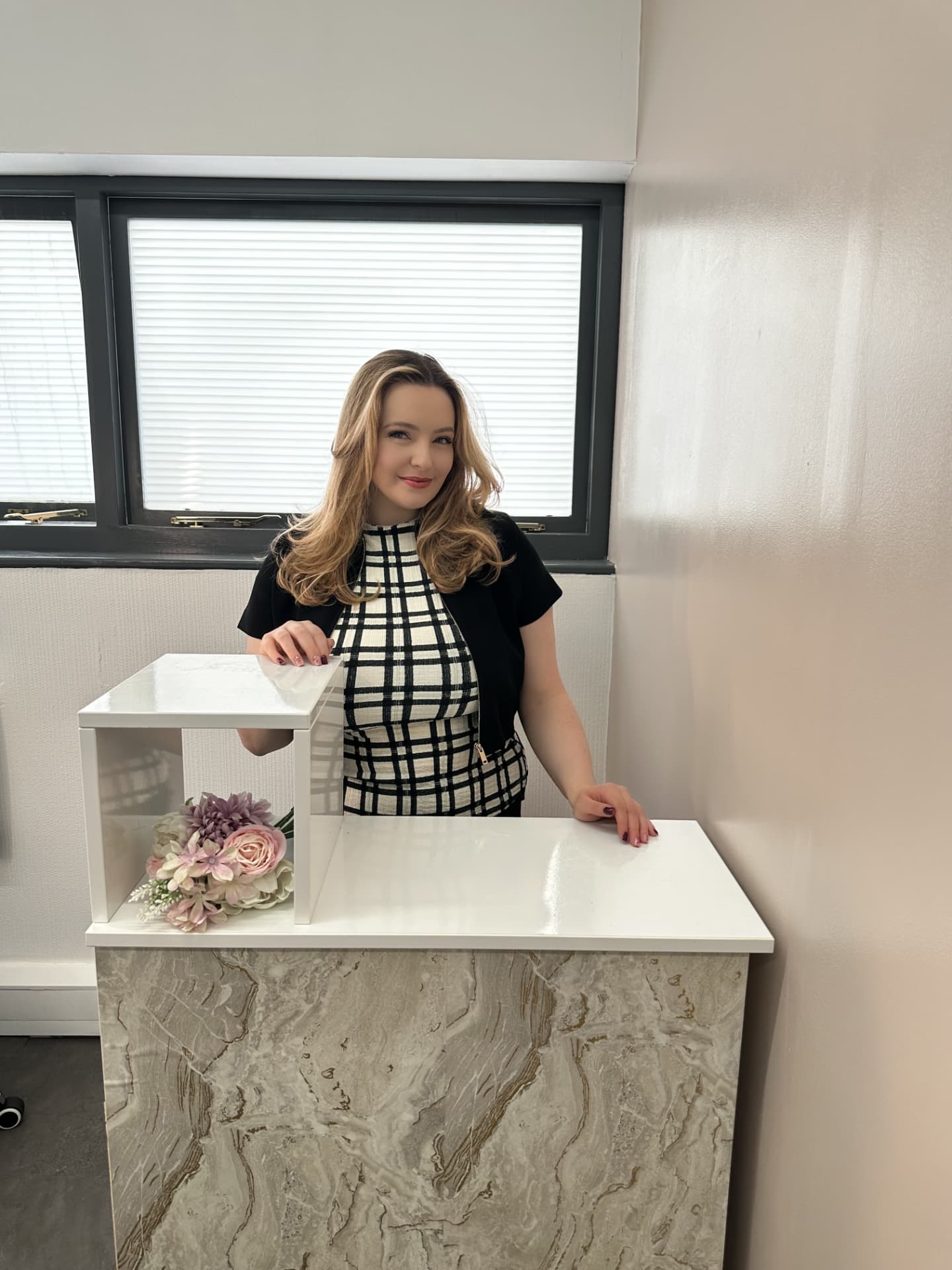 Lauren at her reception desk